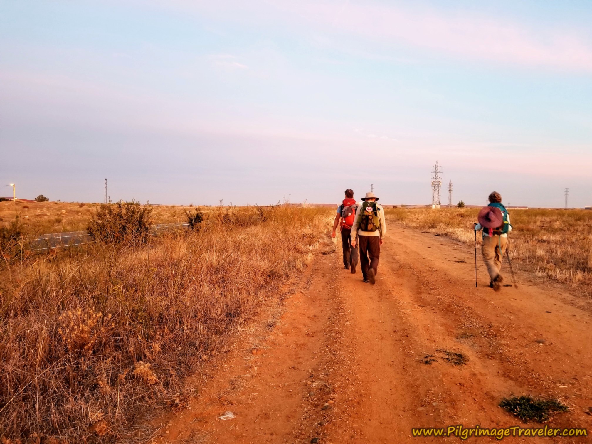Pilgrims Following the Dirt Frontage Road