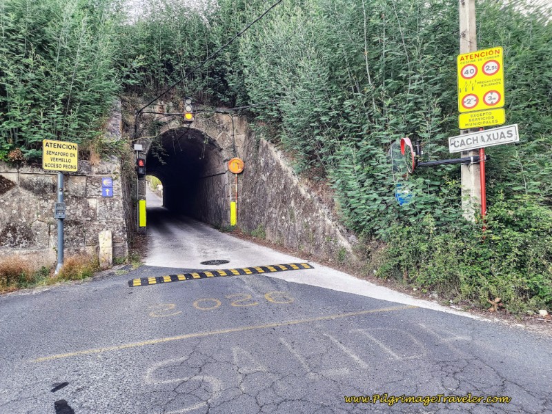 Carefully Walk Through Railroad Tunnel