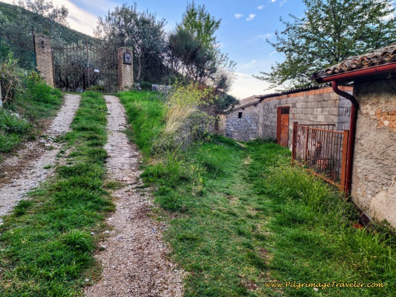 Right Turn Onto Path Through Buildings Way of St. Francis: Day Thirteen, Trevi to Poreta - Right Turn Onto Path Through Buildings