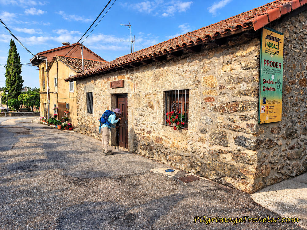 Nadine Peers into the Albergue de Peregrinos de Mombuey