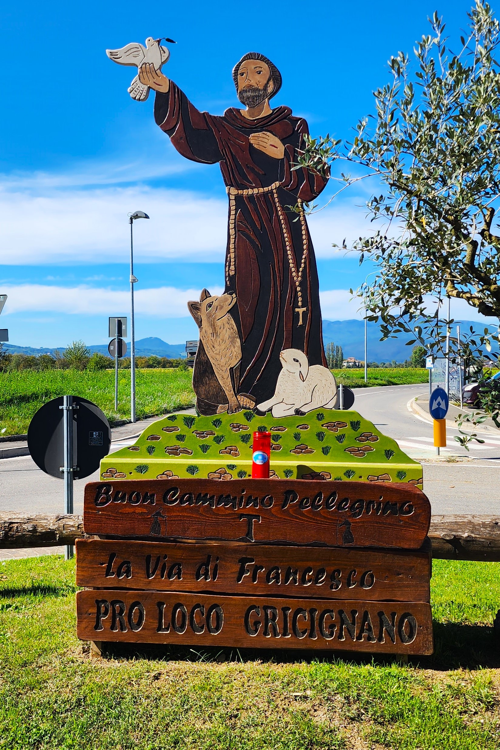 St. Francis in the First Roundabout in Gricignano on day four of the Way of St. Francis from Sansepolcro to Citerna.