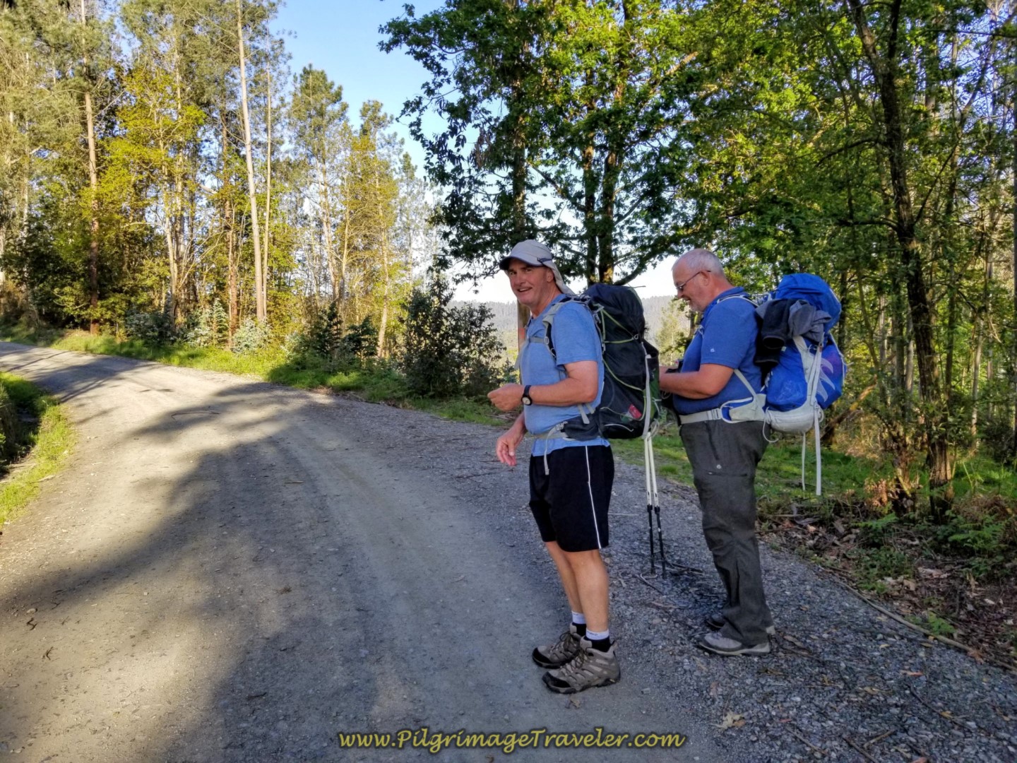 Steve Adjusts Rob's Pack on the Gravel Road on day six of the Camino Inglés