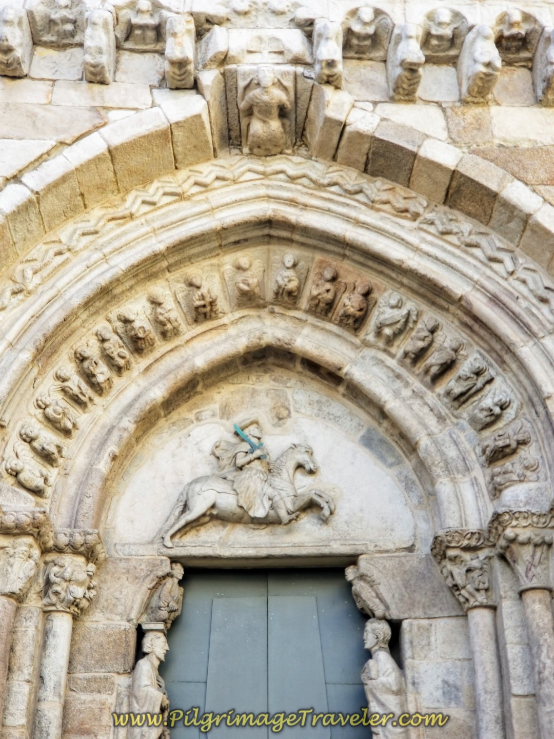 Gothic Portal of the Igrexa de Santiago, depicting the saint as an Equestrian, Santiago Matamoros, on day one of the La Coruña Arm of the Camino Inglés