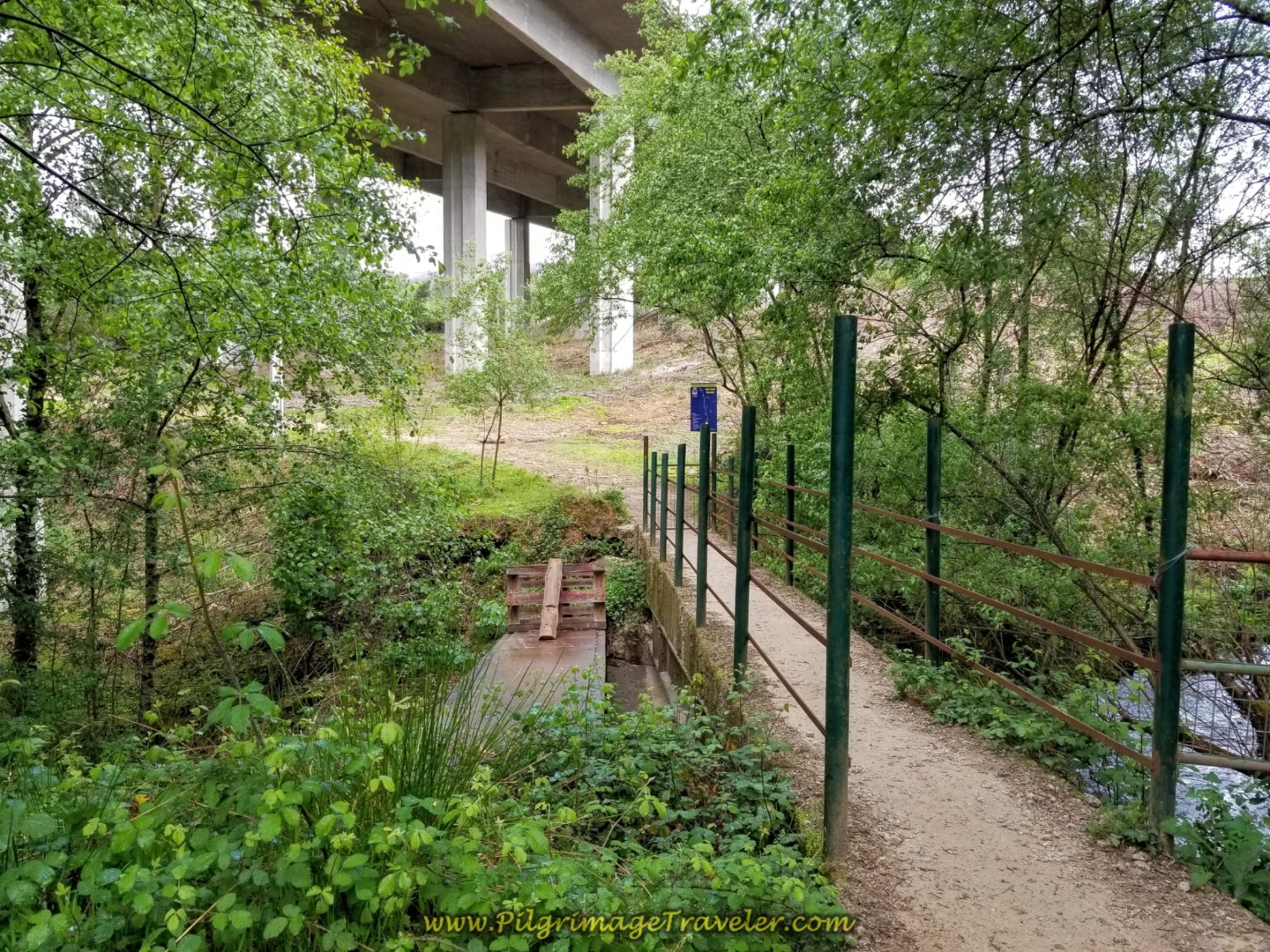 Crossing Bridge Under A3, "Welcome to Labruja" Sign on day eighteen on the Central Route of the Portuguese Camino