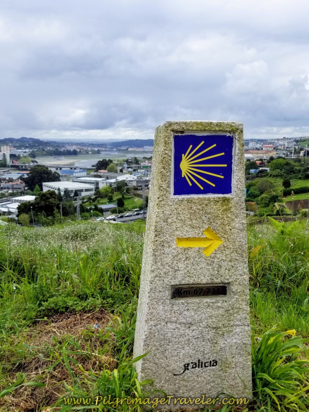 67.7 Kilometer Marker and Ría de Coruña Estuary on day one of the La Coruña Arm of the Camino Inglés