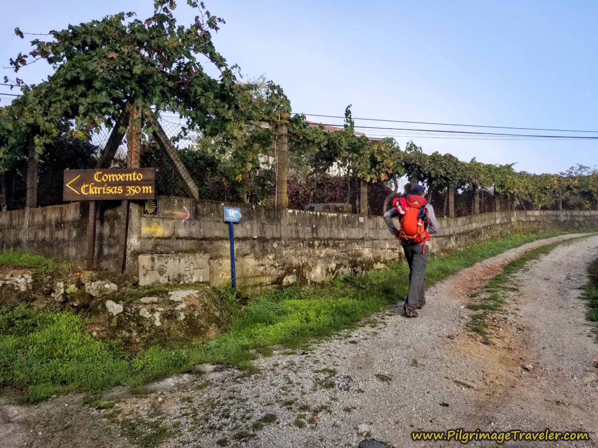Right Turn by Grape Arbor and Convent Sign, Camino Sanabrés, Ourense to Cea