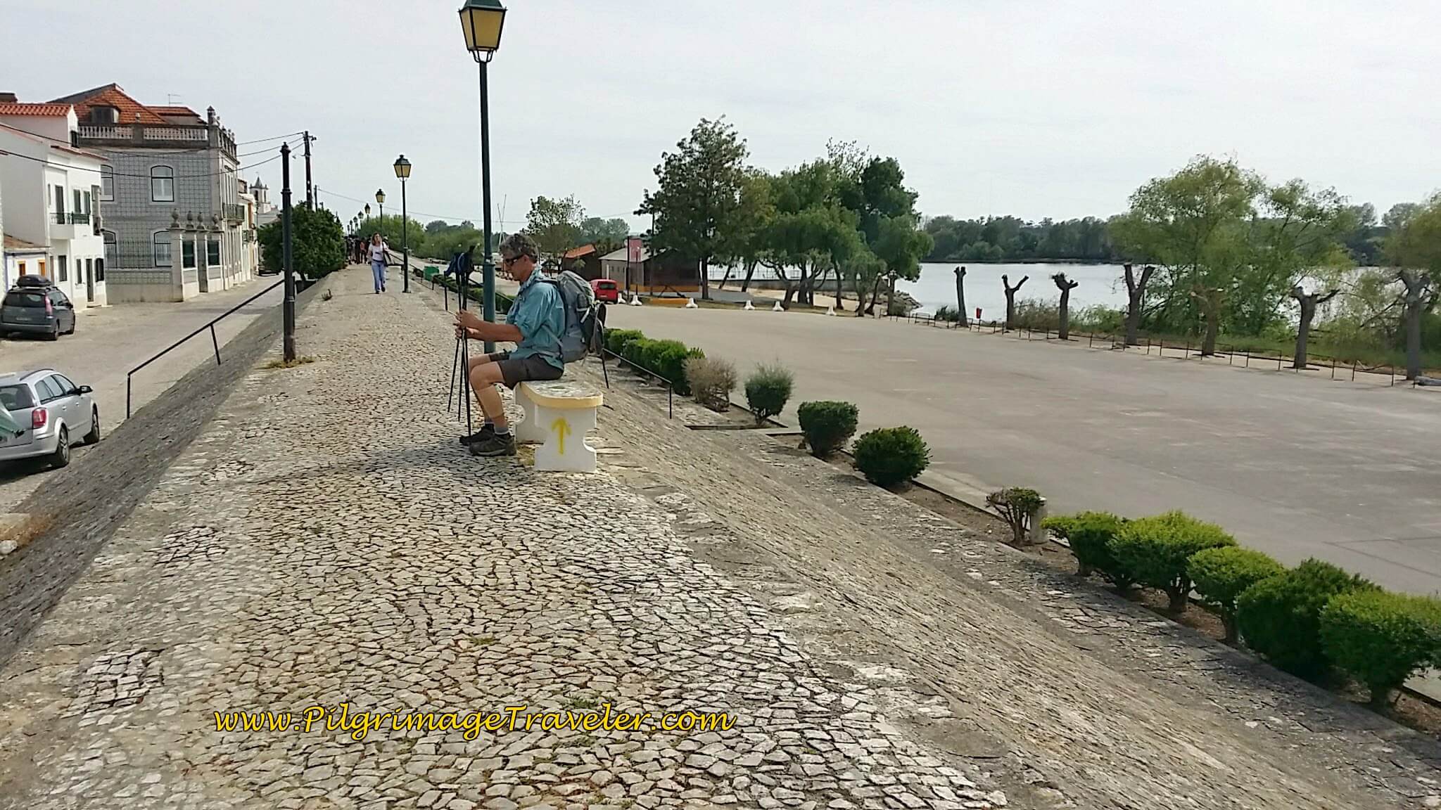 Rich Sitting on Bench on the Camino Along the Dike in Valada, Portugal