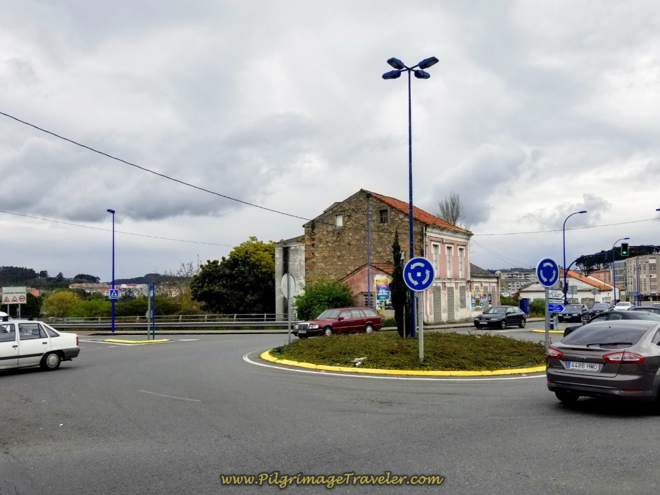 Left at Roundabout Toward the River on day one of the La Coruña Arm of the Camino Inglés Left at Roundabout Toward the River on day one of the La Coruña Arm of the Camino Inglés
