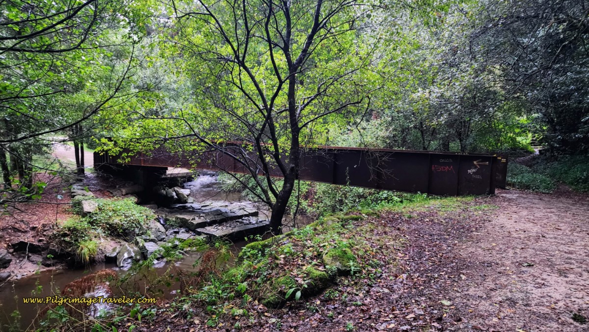 Cross the Rio Ulló on Metal Bridge