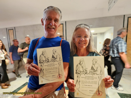 Way of St. Francis: Day Twenty-Three, Monte Sacro to Rome - Rich and Elle with Testimoniums at Pilgrim's Desk, St. Peter's Basilica