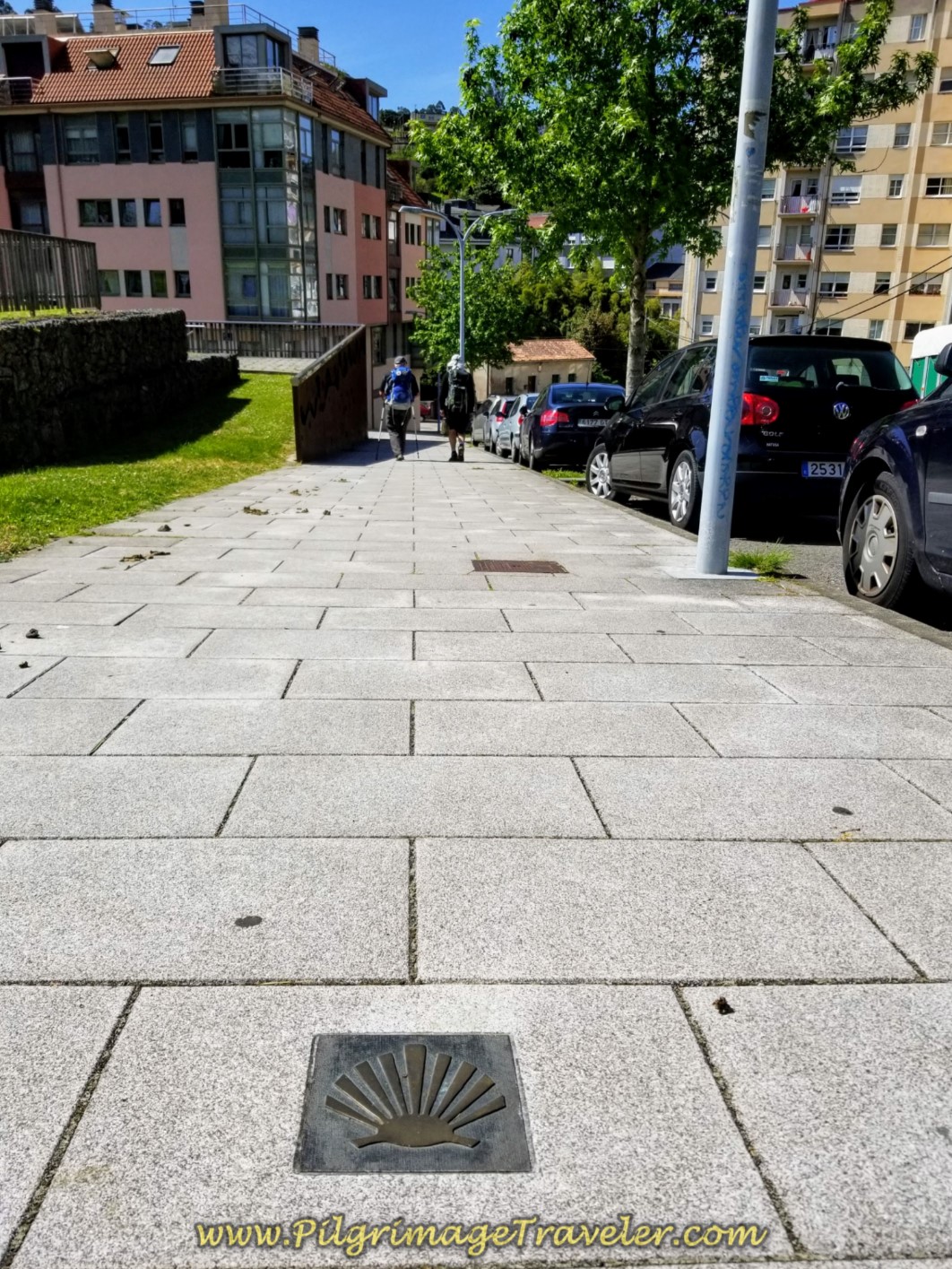 Embedded Waymark on the Sidewalk Along the Rúa Rollo on day five of the Camino Inglés