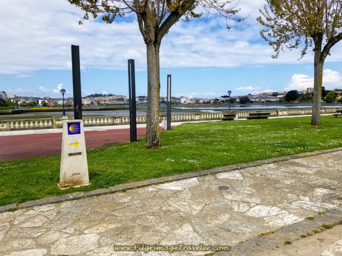Kilometer Marker 64.4 by the River on day one of the La Coruña Arm of the Camino Inglés Kilometer Marker 64.4 by the River on day one of the La Coruña Arm of the Camino Inglés