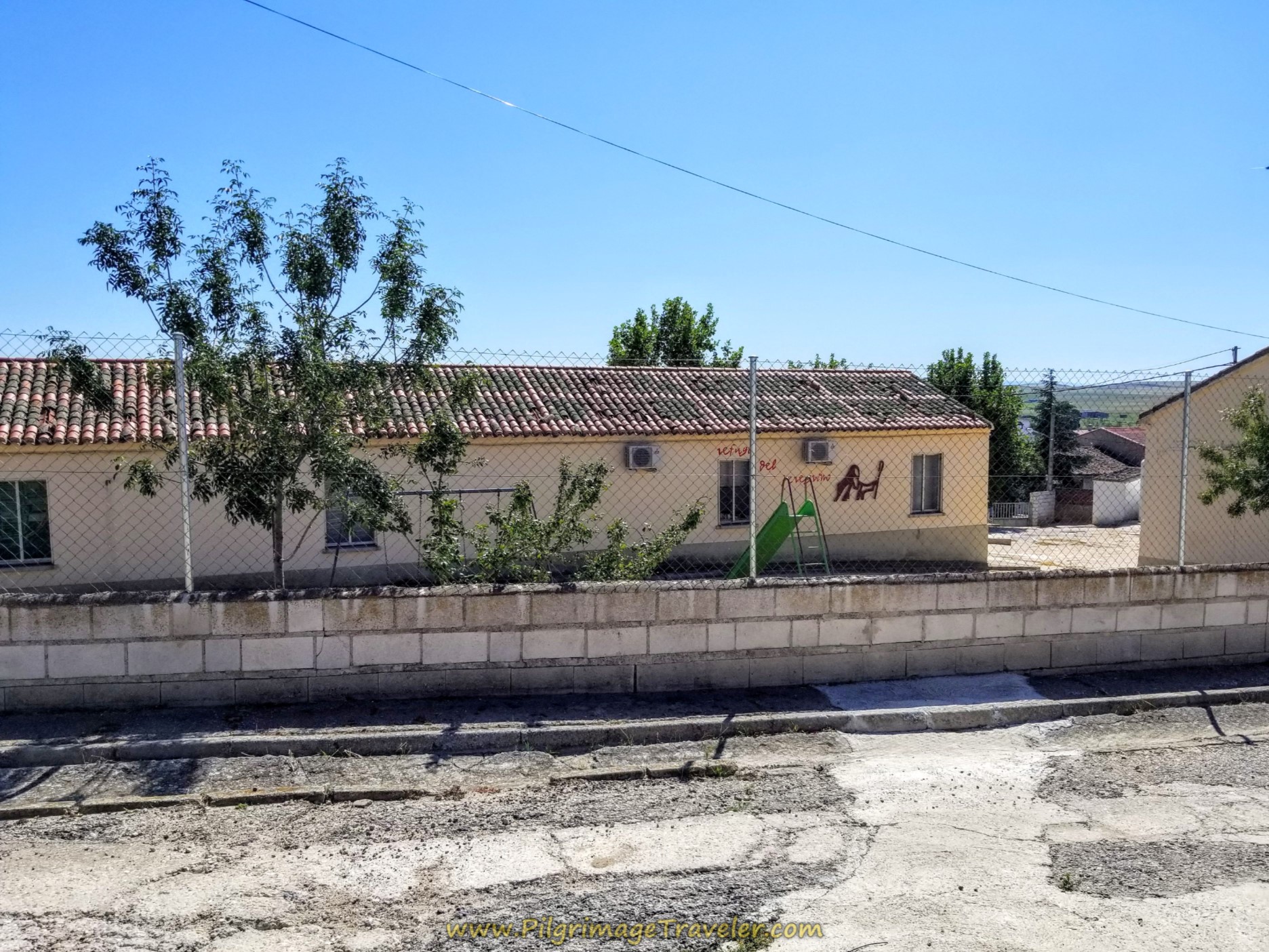 Pass the Albergue de Peregrinos de Santa Teresa