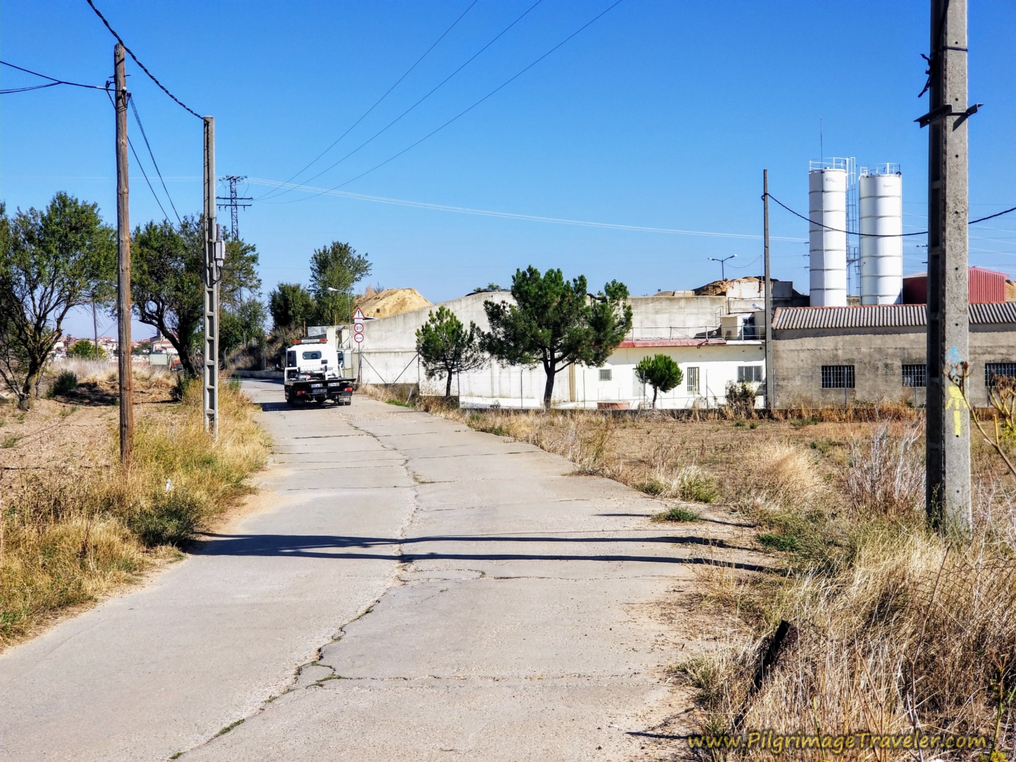 Pavement Begins at Cement Factory Pavement Begins at Cement Factory