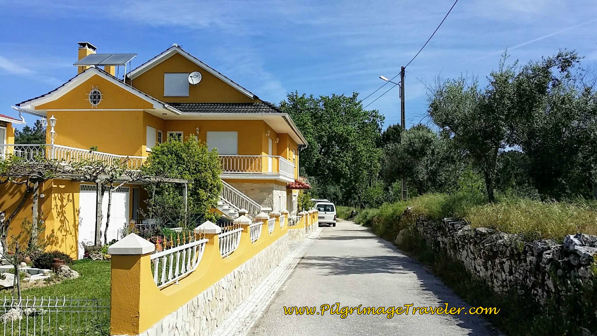 Paved Road Ends at Bright Yellow House in Ansião on the Portuguese Way