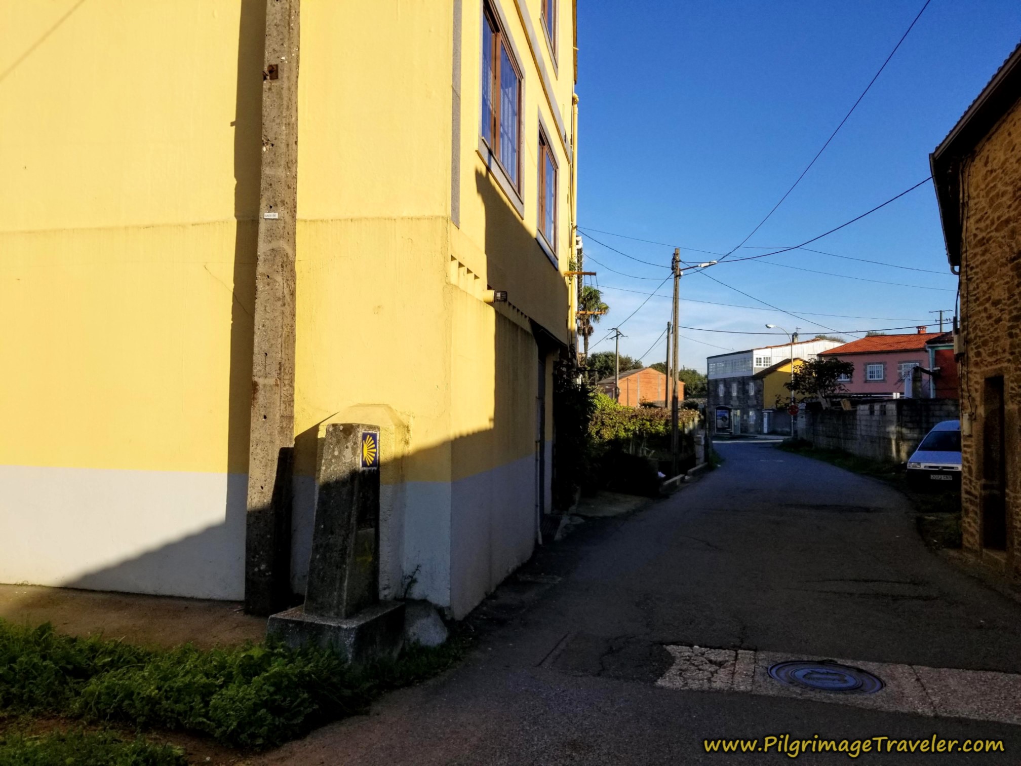 Continue on the Rúa de Angrois