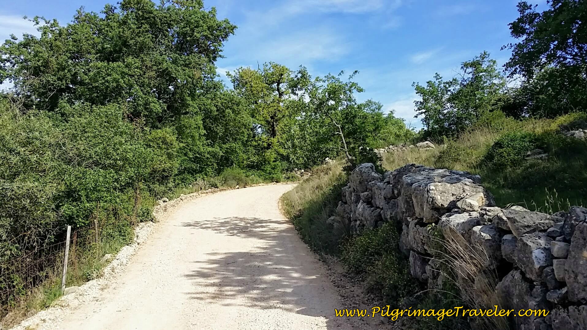 Stone Wall Lines the Road