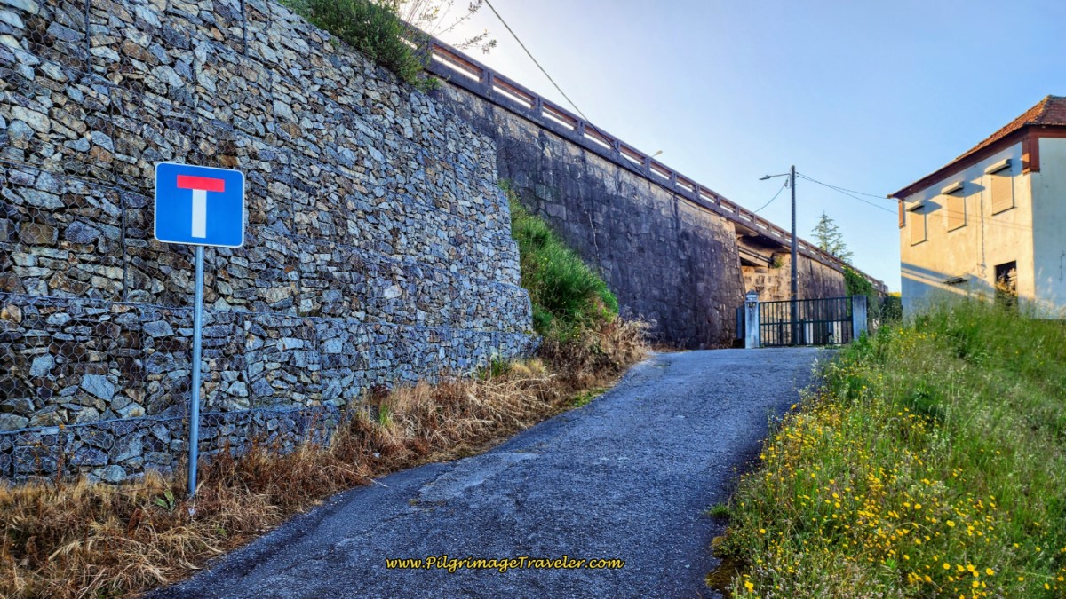 Right Turn at Bridge Onto Paved Lane