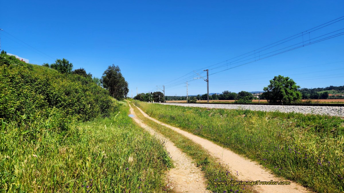 Dirt Track Parallels the Railroad Tracks