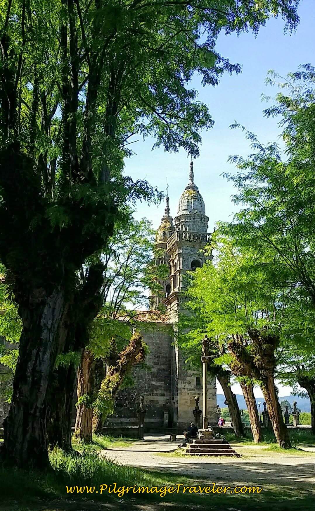 Pause in the shade of the Santuario da Virxe da Escravitude in A Escravitude on day twenty-four, Portuguese Camino.