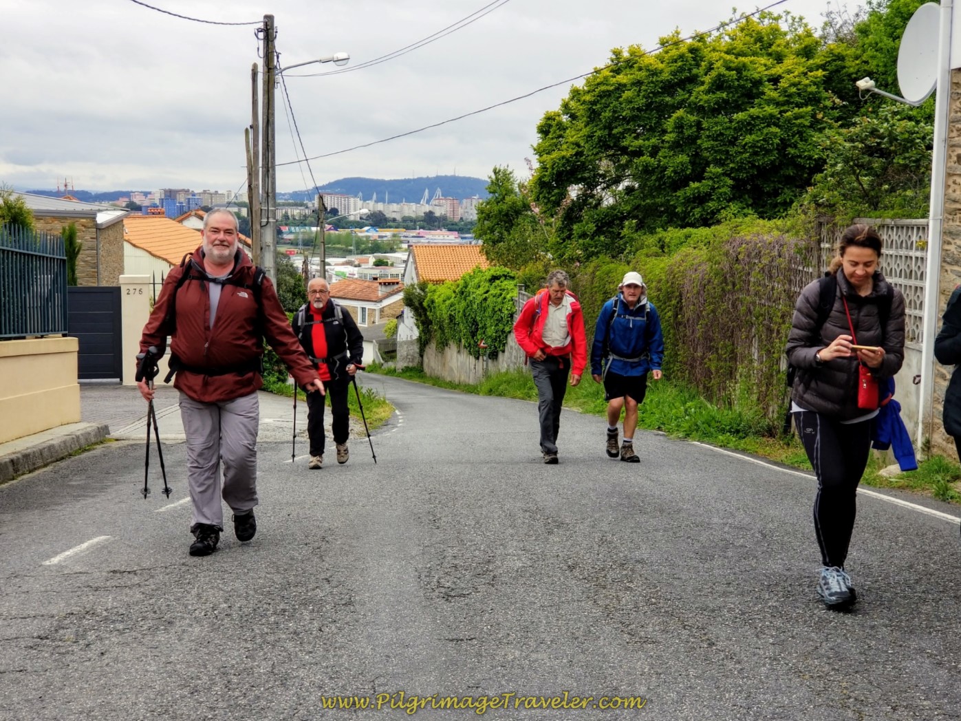 Pilgrims on the Steep Climb Up the Camiño do Vilar Street on day one of the Camino Inglés