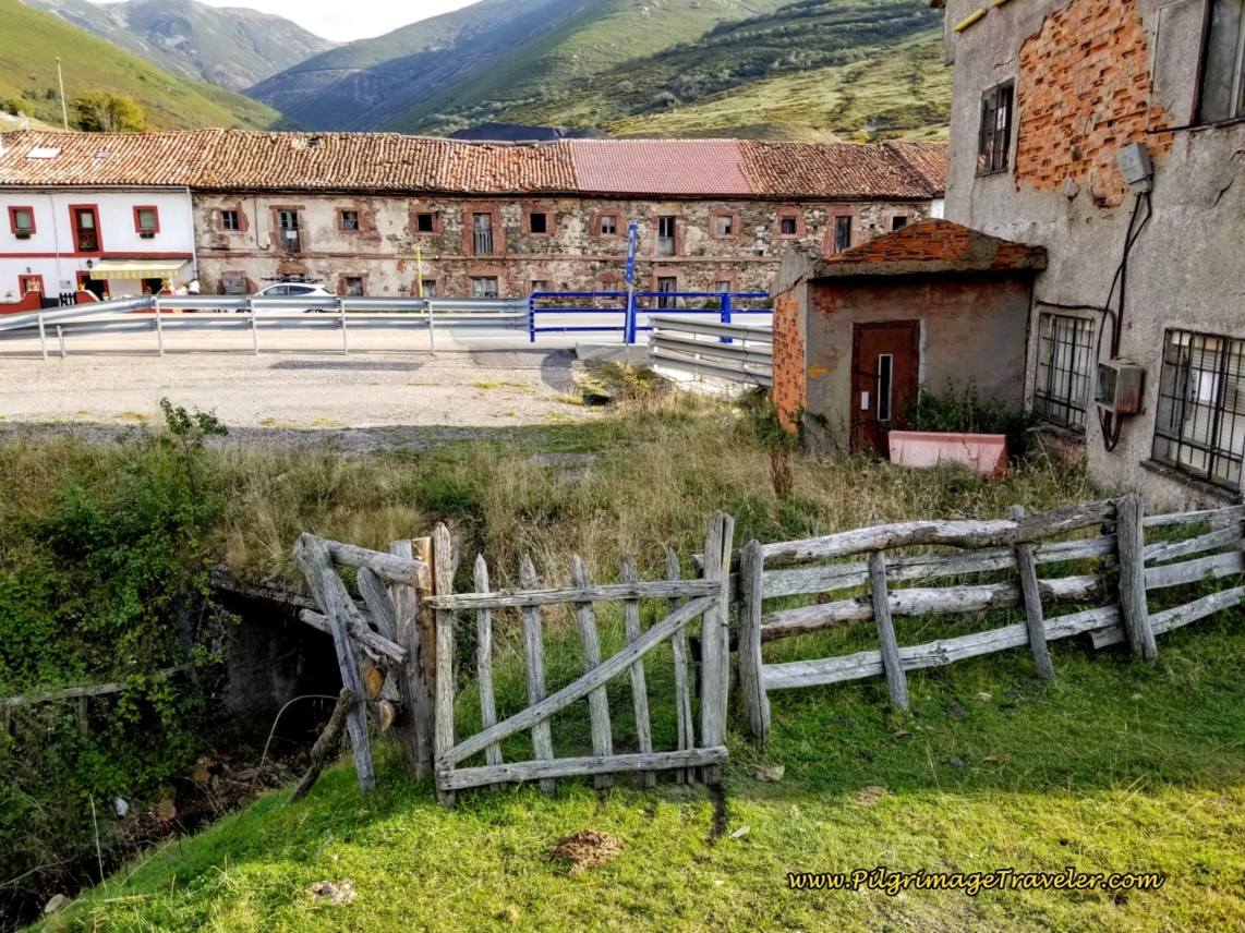 Find the Gate to the Left of the Farm Building