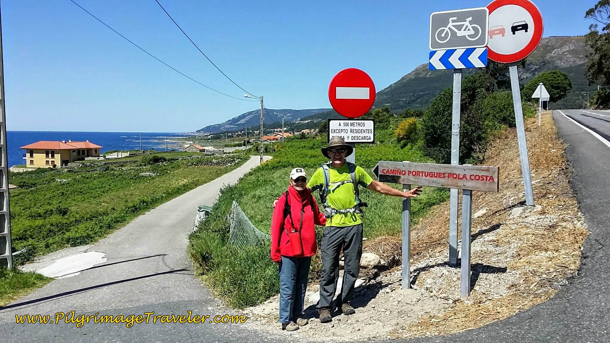 Sign "Camiño Portugués Pola Costa" in Spain on Day Nineteen of the Camino Portugués