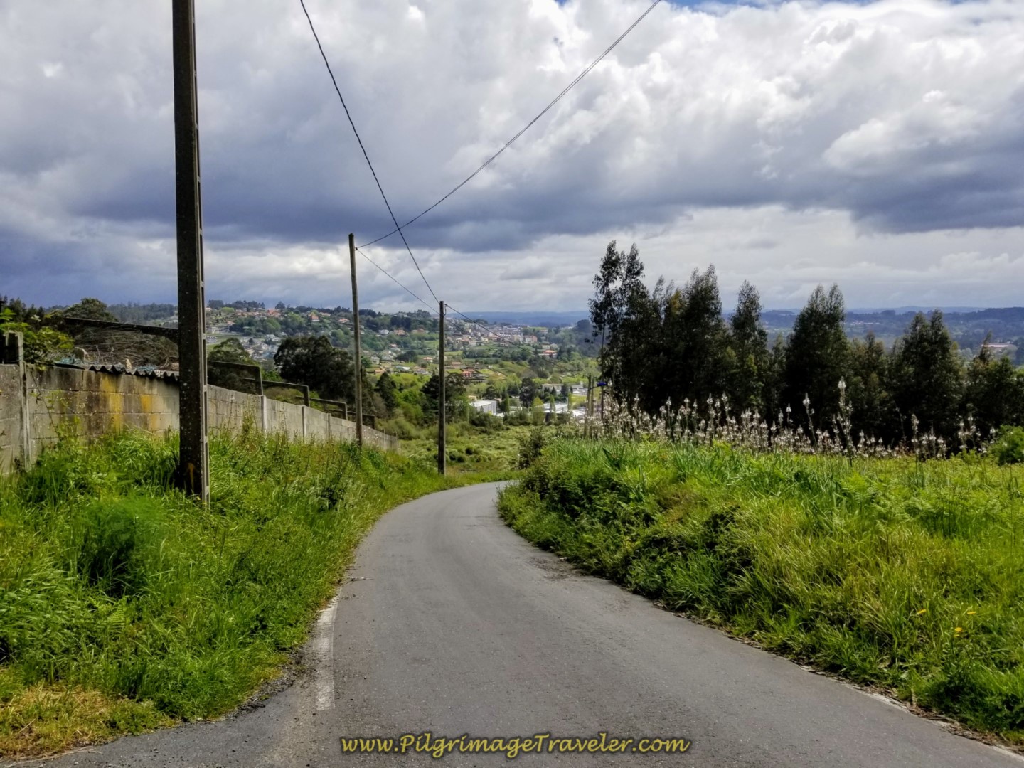 Continue Downhill on Rural Road on day one of the La Coruña Arm of the Camino Inglés