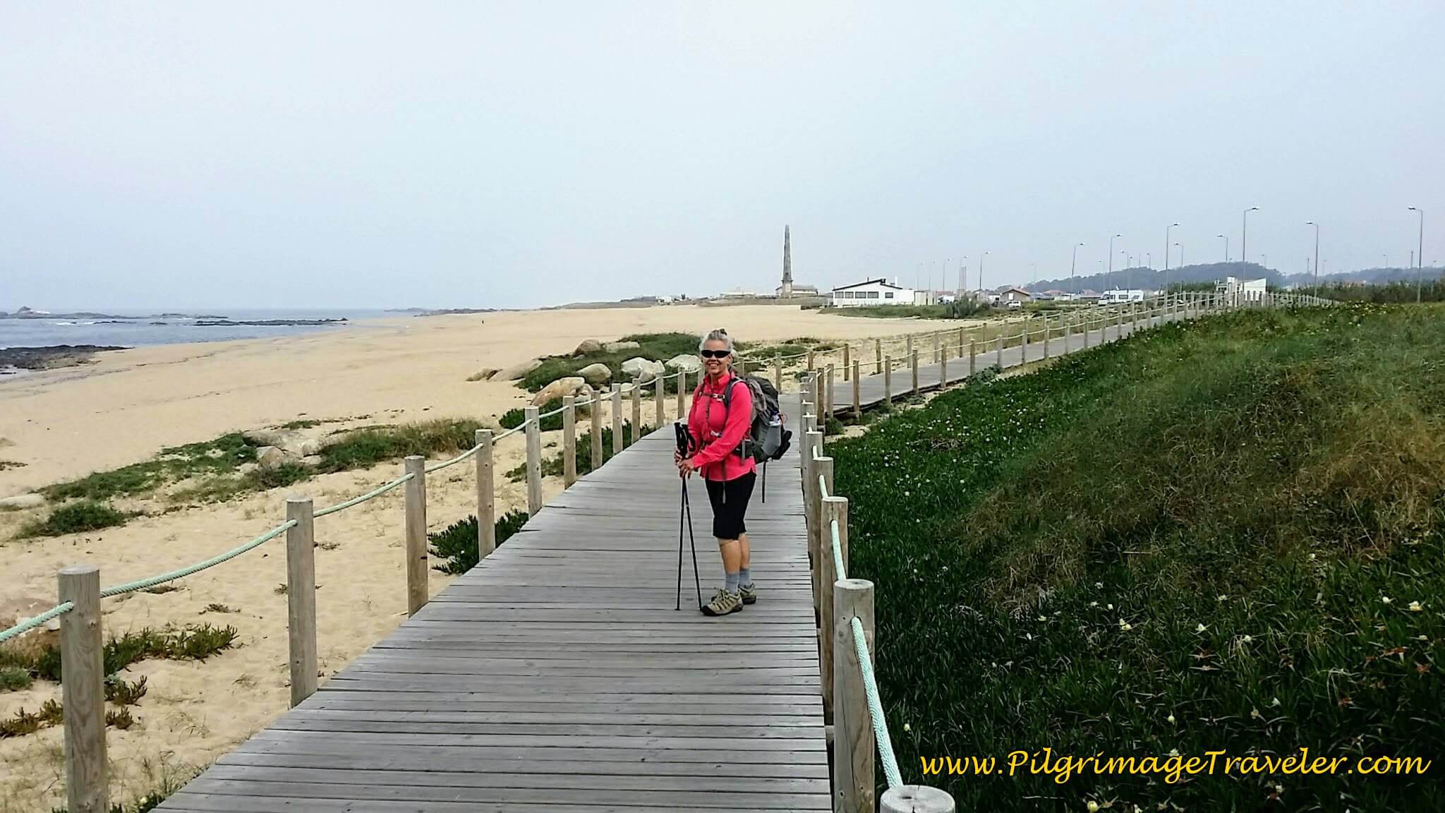 Elle on Praia da Memória Boardwalk on day fifteen of the Camino Portugués on the Senda Litoral