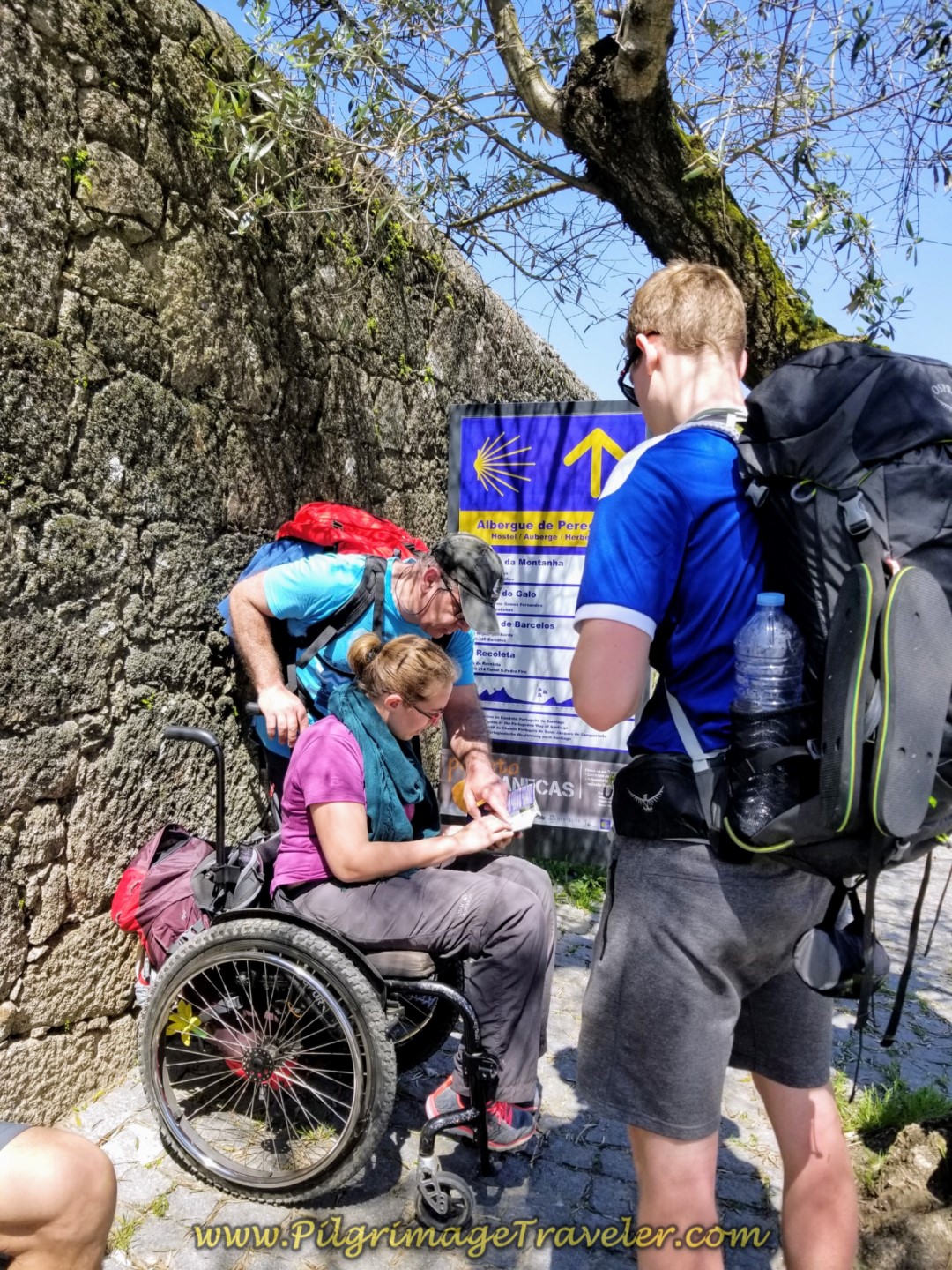Pedro, Magdalena and Magnus conferring with the map in Pedra Furada on day sixteen on the Central Route of the Portuguese Way