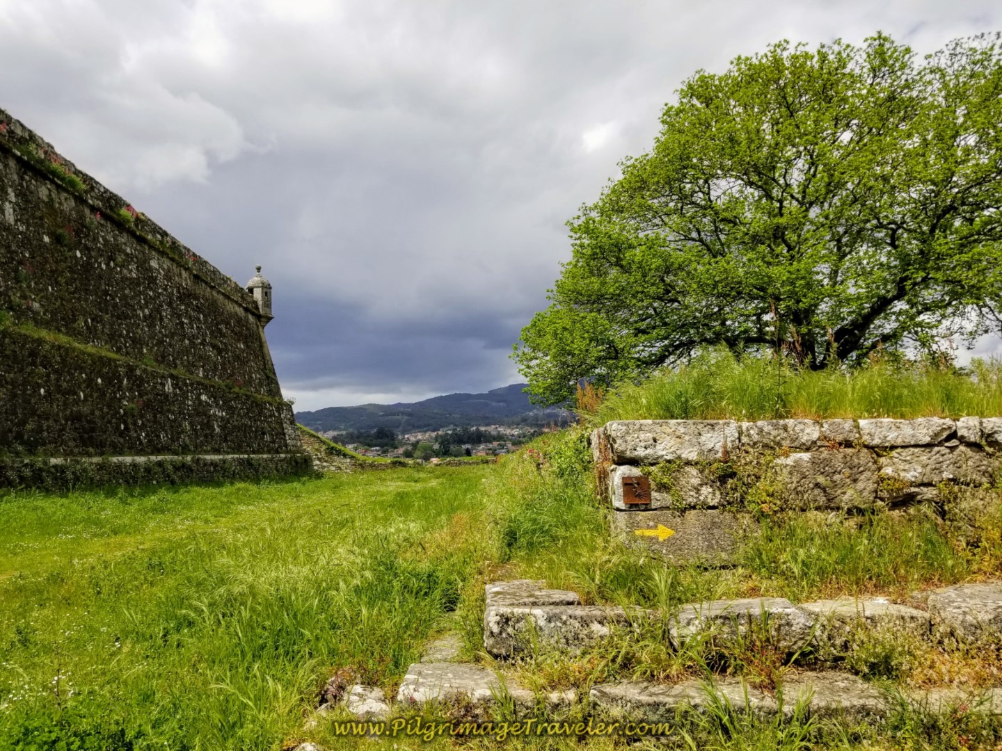 Camino Yellow Arrow on the Outer Ramparts of Valença on day nineteen on the Central Route of the Portuguese Camino