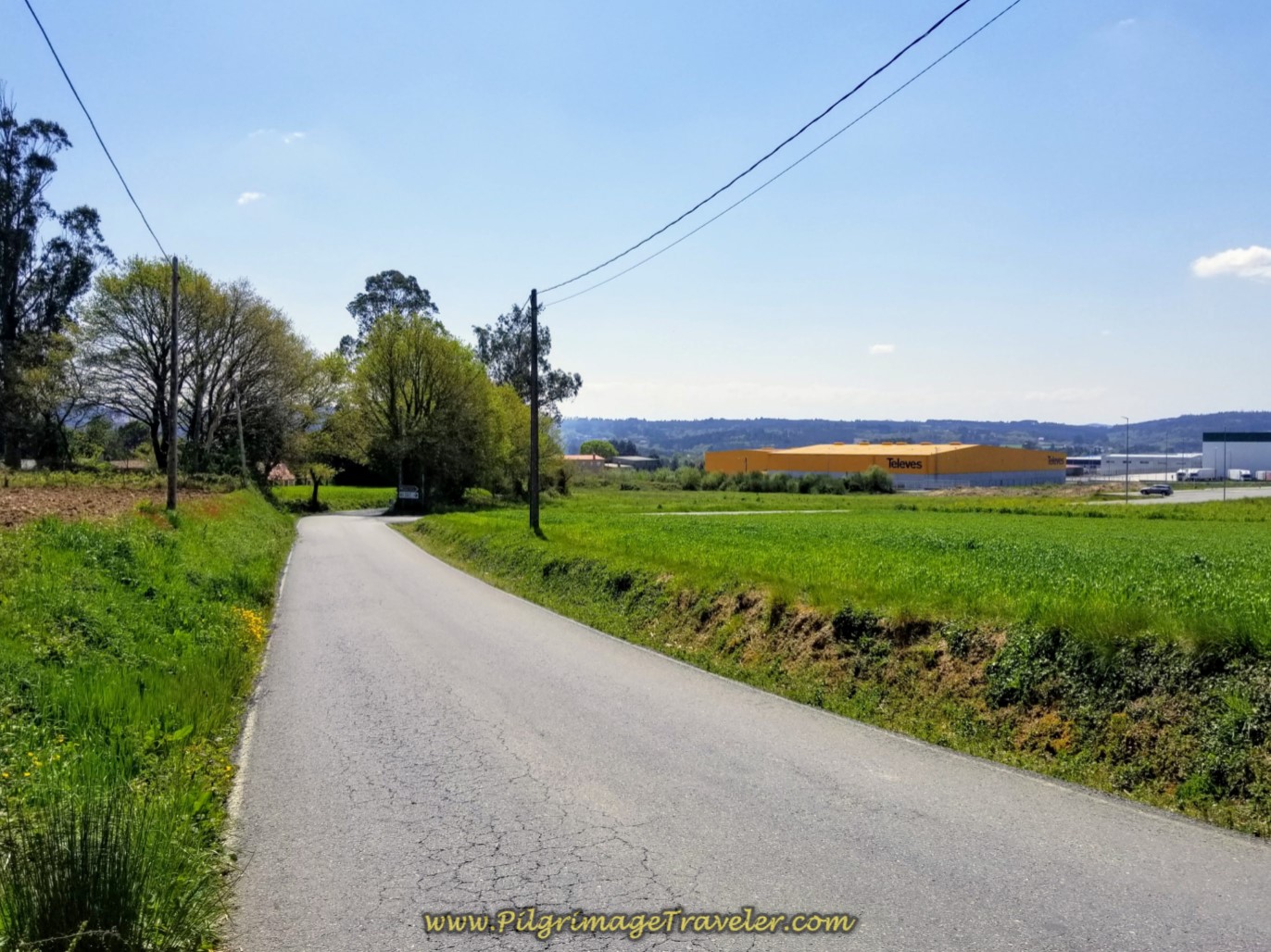 Left Turn from the E-1 Onto Long, Hot Pavement toward Industrial Park of Sigüeiro on day seven of the English Way