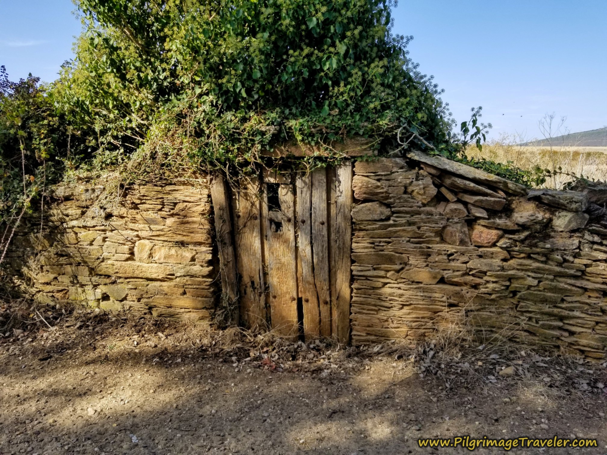 Walled Entrance to Town with Old Door on the Camino Sanabrés from Granja de Moreruela to Tábara
