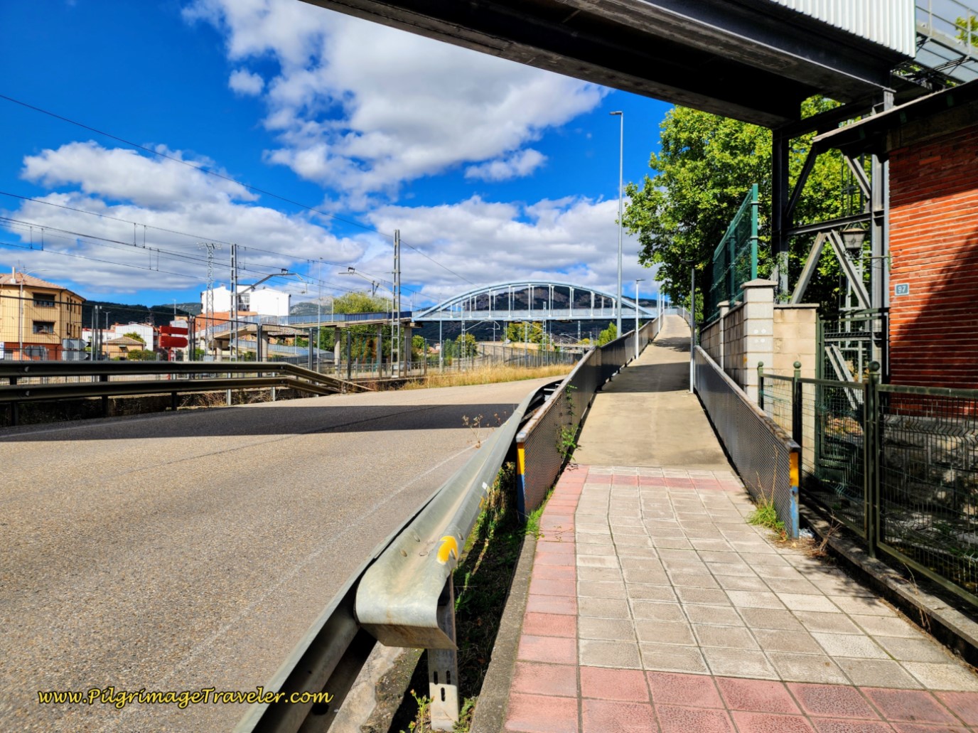 Follow Arrows to Pedestrian Walkway Over Street