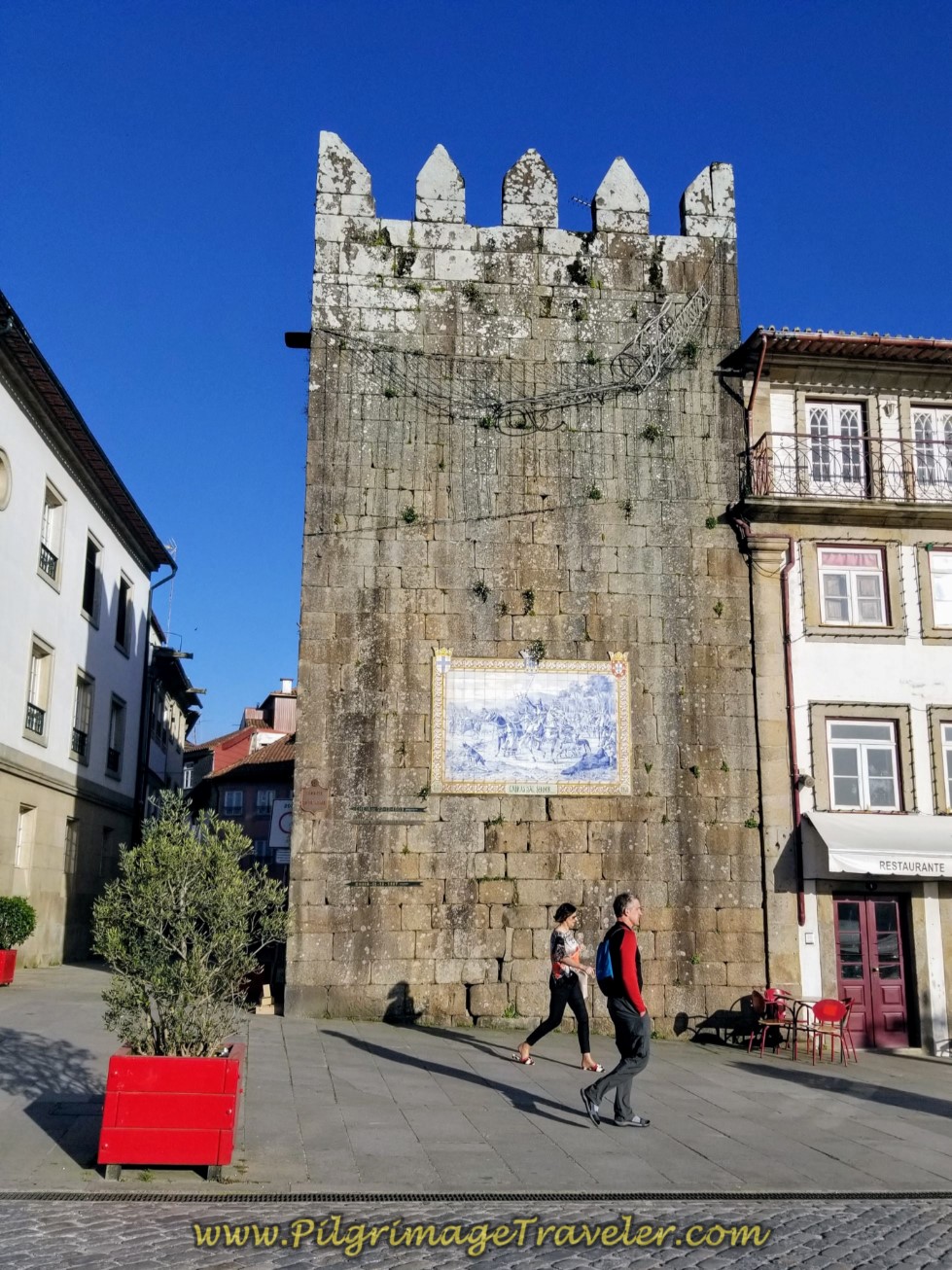 Rich Walking by the Torre de São Paulo in Ponte de Lima on day seventeen on the Central Route of the Camino Portugués