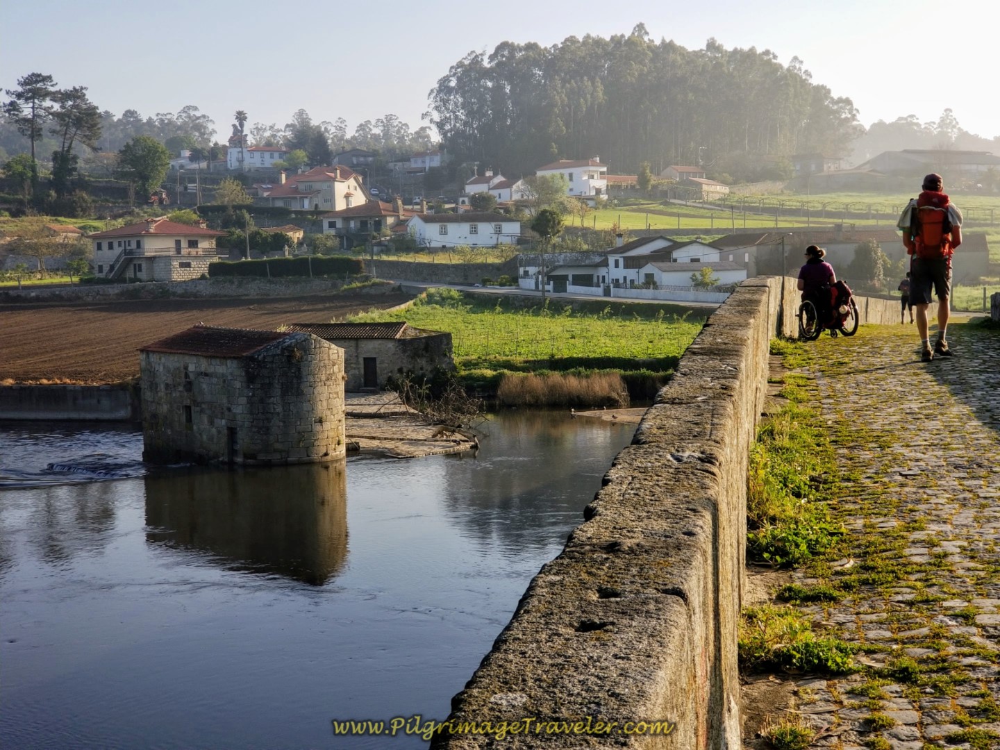 Magdalena Gazes Into the Water at the Ponte D. Zameiro, in Ponte do Ave, Portugal on the Central Route of the Camino Portugués