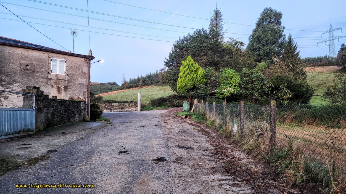 Pass Cluster of Building and Onto Dirt Lane