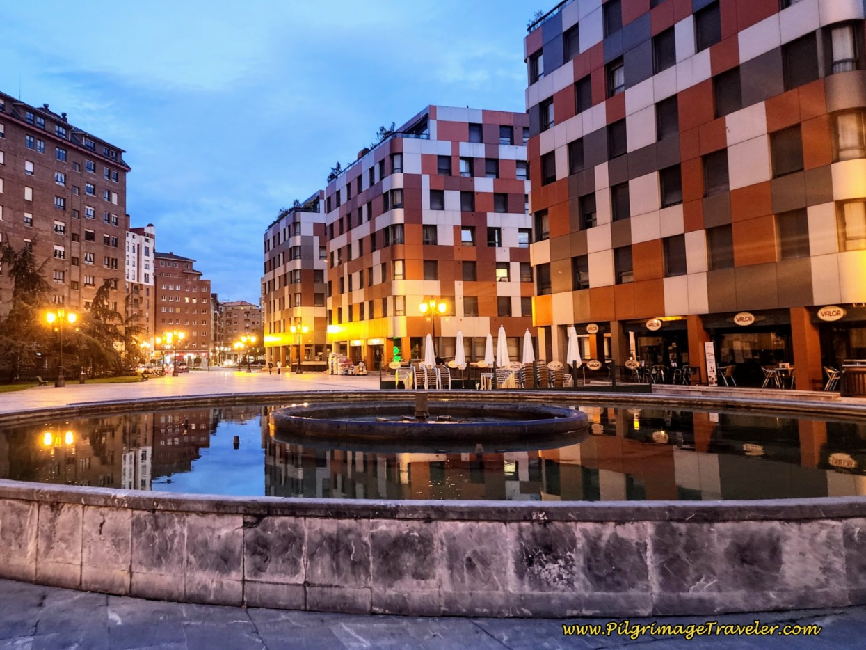 Pass Colorful Apartment Buildings at Fountain