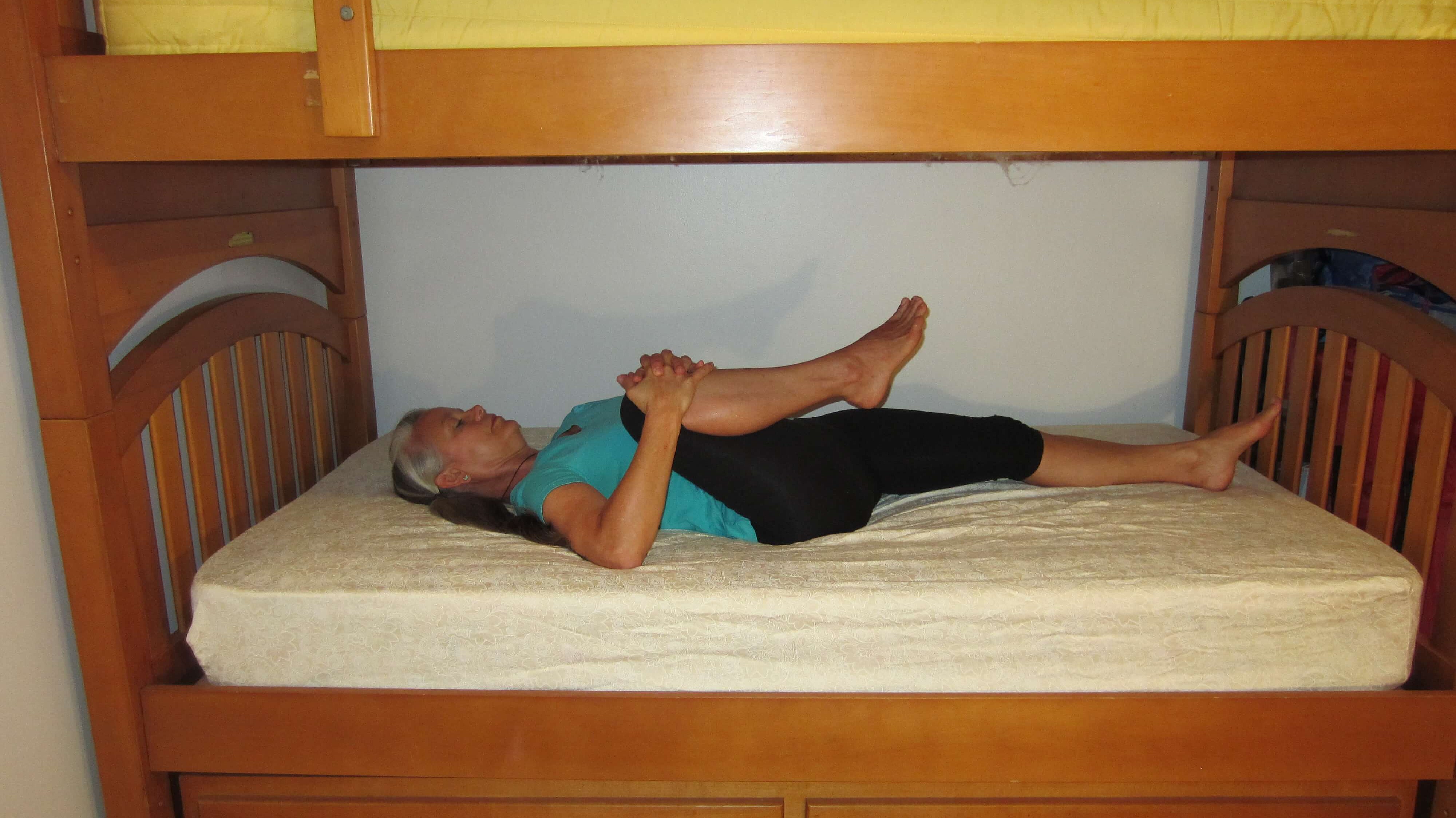Knee to Chest Bunkbed Yoga Pose